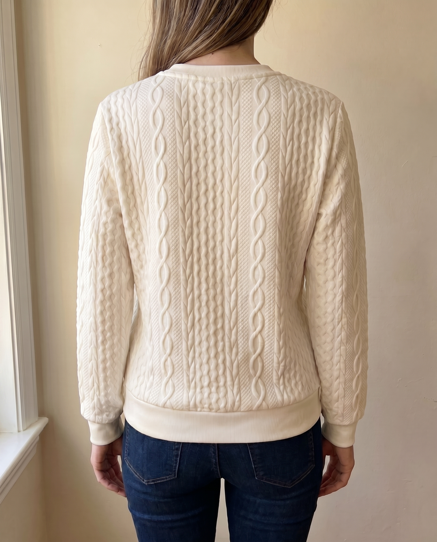 Close-up of the textured back of the cream Gastown Textured Zip Sweatshirt