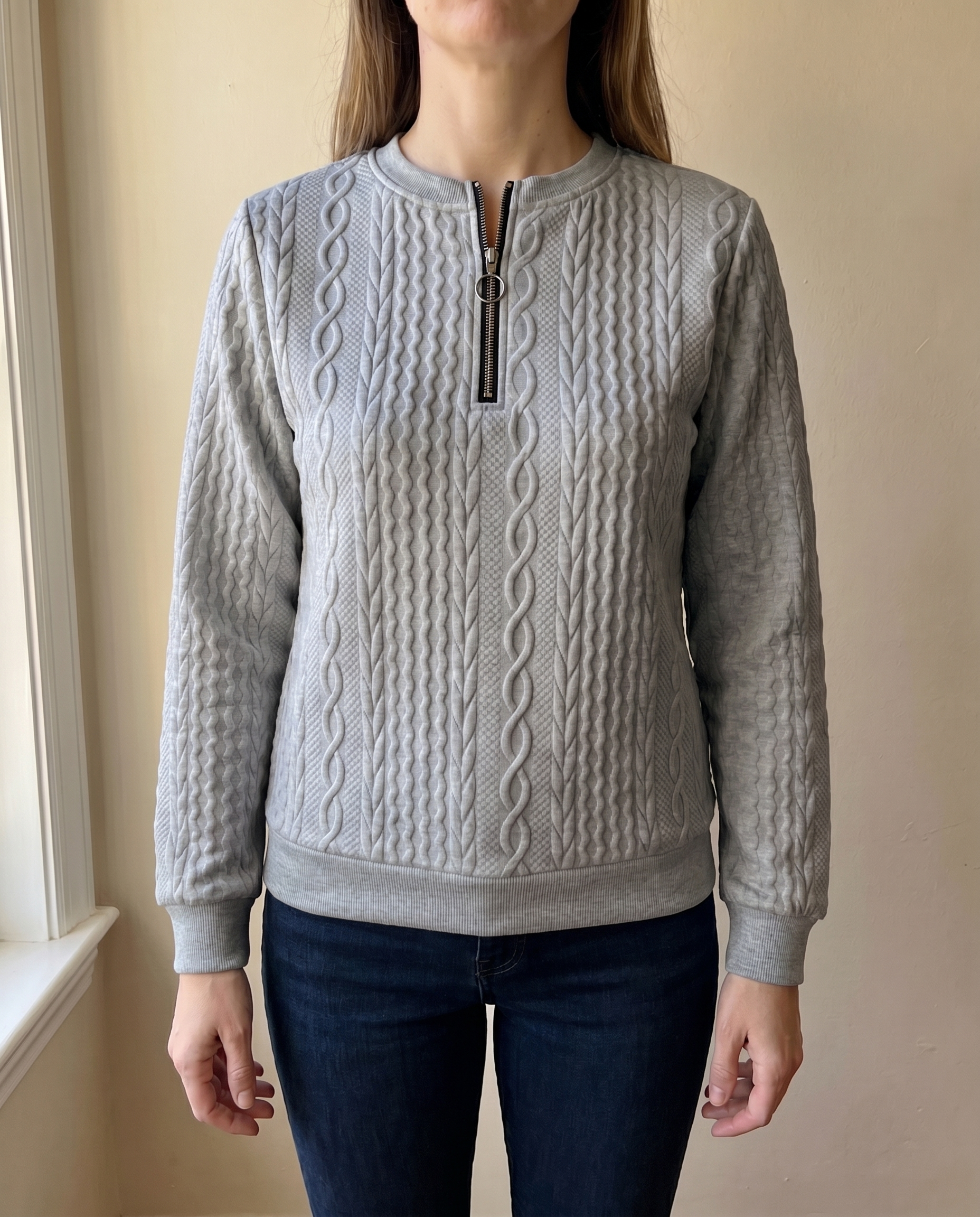 Close-up of the high zip neck on the grey Gastown Textured Zip Sweatshirt
