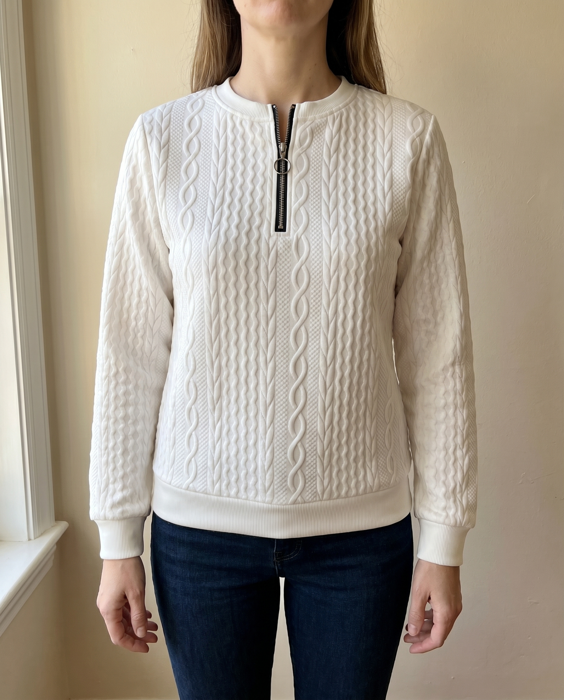 Close-up of the high zip neck on the white Gastown Textured Zip Sweatshirt