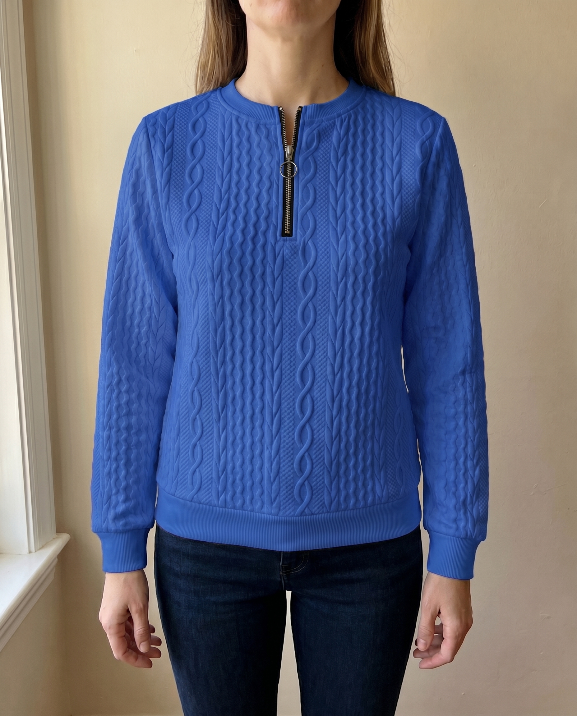 Close-up of the high zip neck on the blue Gastown Textured Zip Sweatshirt